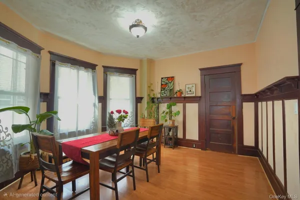 a view of a dining room with furniture and a chandelier