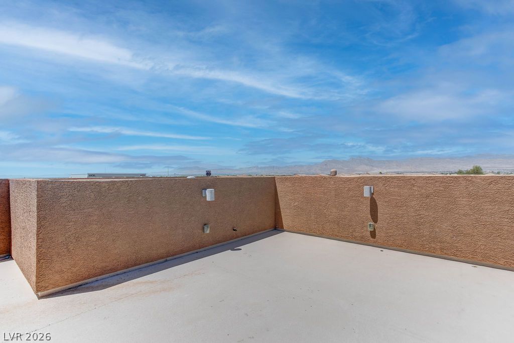 4650 Ranch House Road, Unit 47 North Las Vegas, NV 89031 - Photo 17 of 43 Uninterrupted desert mountain vistas from this spacious rooftop deck, ideal for tranquil evenings.