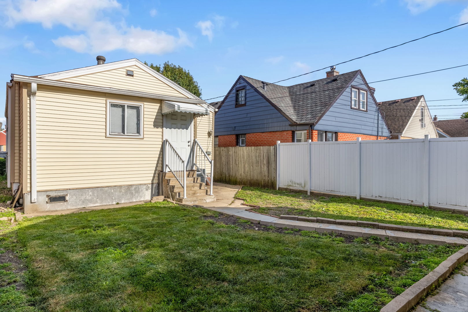 1528 North 39th Avenue Stone Park, IL 60165 - Photo 14 of 16 a front view of a house with a yard