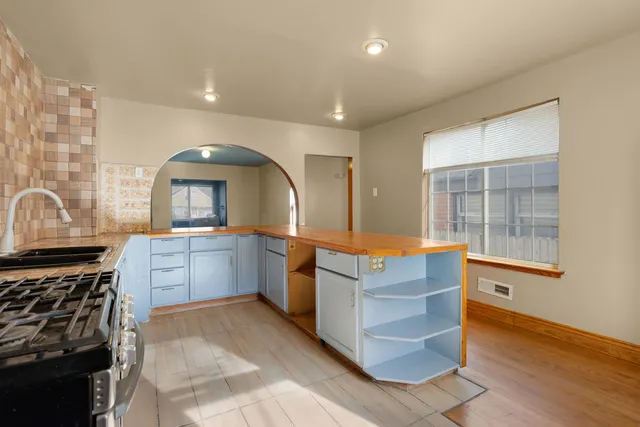 a view of room with window and wooden floor