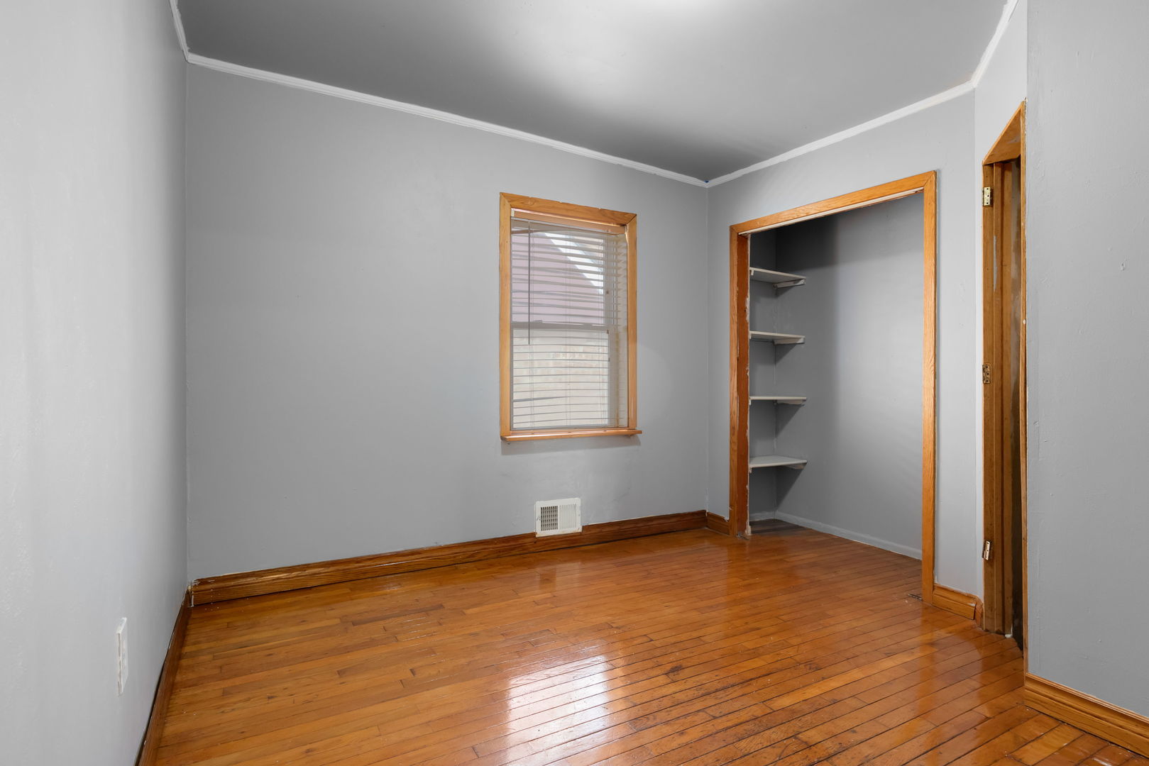 1528 North 39th Avenue Stone Park, IL 60165 - Photo 7 of 16 a view of room with window and wooden floor