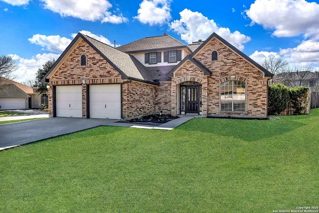 a front view of house with yard and green space