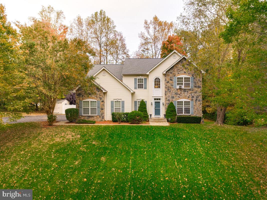 Welcome to this beautiful stone-front Colonial
