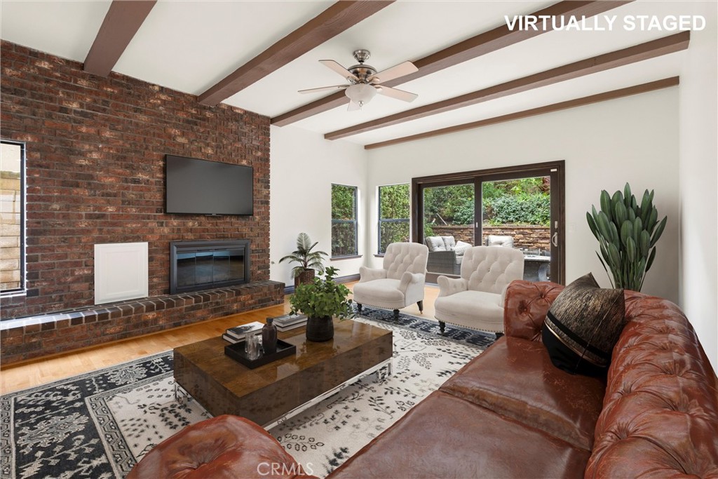 24692 Kings Road Laguna Niguel, CA 92677 - Photo 11 of 39 a living room with furniture fireplace and a flat screen tv