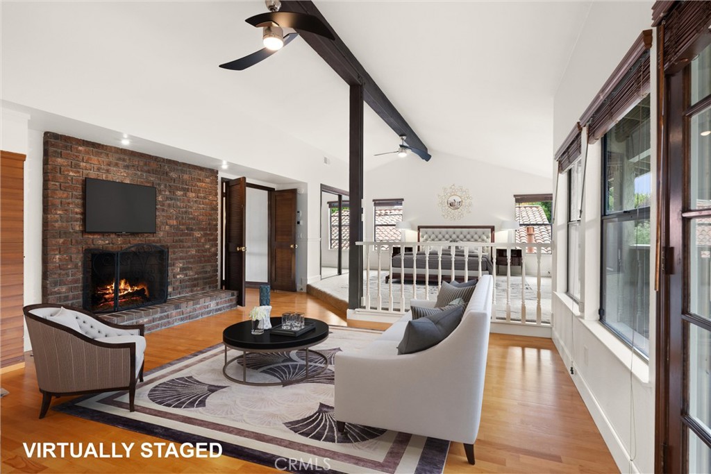 24692 Kings Road Laguna Niguel, CA 92677 - Photo 14 of 39 a living room with furniture and a fireplace