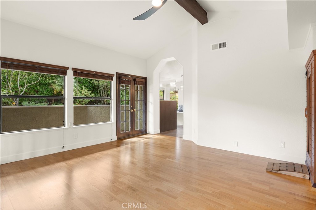 24692 Kings Road Laguna Niguel, CA 92677 - Photo 15 of 39 a view of an empty room with wooden floor and a window