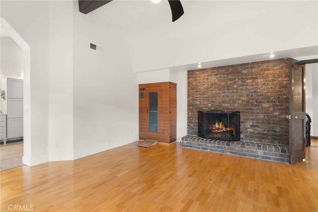 24692 Kings Road Laguna Niguel, CA 92677 - Photo 16 of 39 a living room with furniture and a fireplace