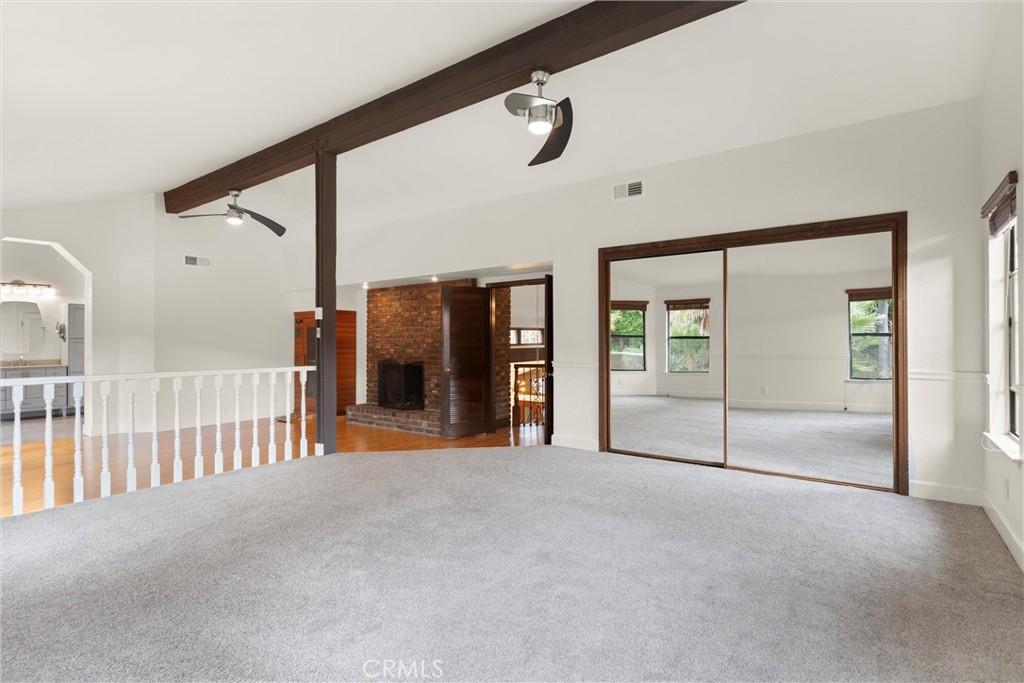 24692 Kings Road Laguna Niguel, CA 92677 - Photo 17 of 39 a view of a hallway with wooden floor and door