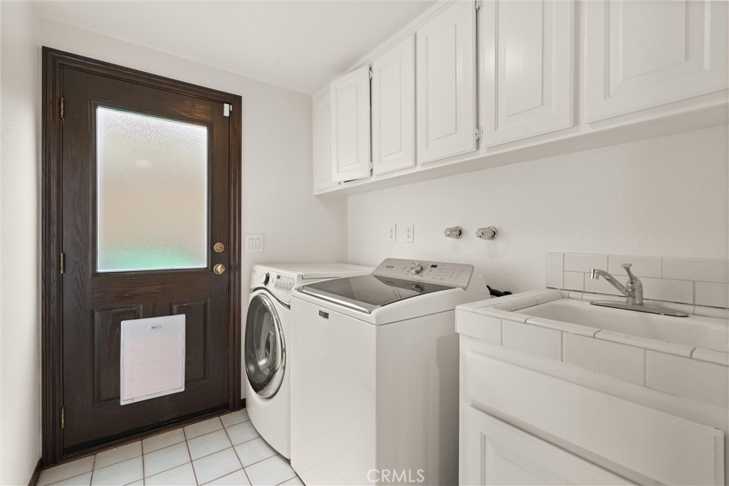 24692 Kings Road Laguna Niguel, CA 92677 - Photo 33 of 39 a utility room with dryer and washer