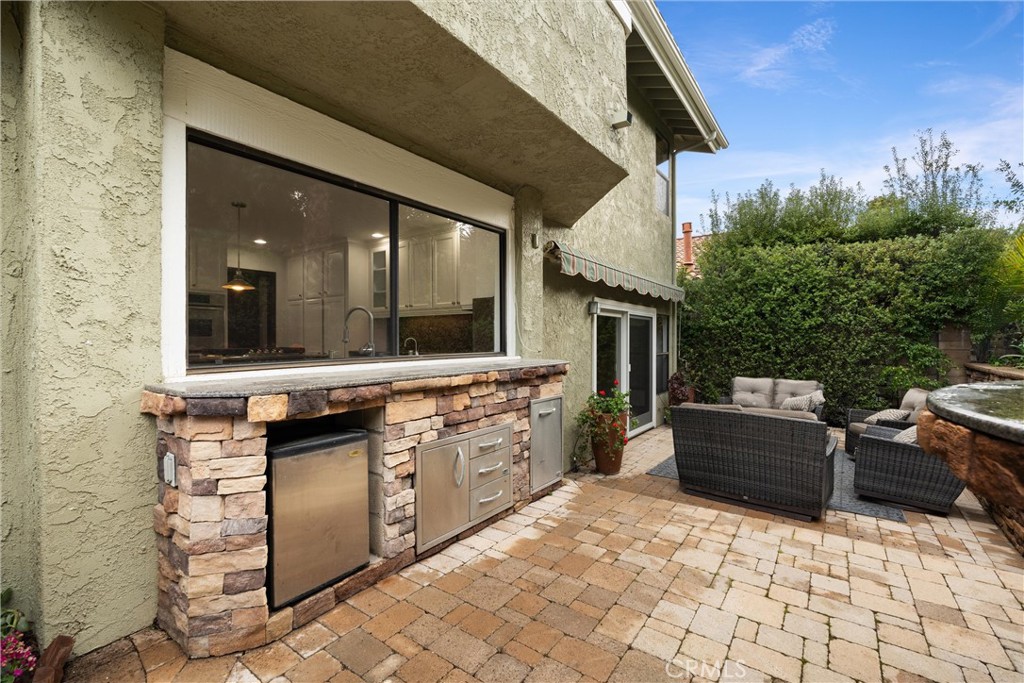 24692 Kings Road Laguna Niguel, CA 92677 - Photo 35 of 39 a large white kitchen with a stove and a sink