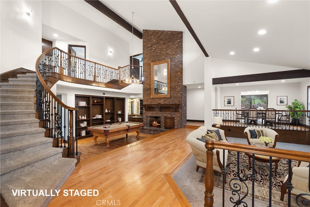 24692 Kings Road Laguna Niguel, CA 92677 - Photo 4 of 39 a view of a livingroom with furniture fire place and kitchen view