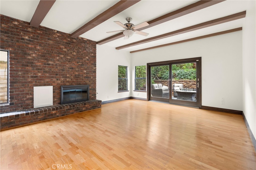 24692 Kings Road Laguna Niguel, CA 92677 - Photo 10 of 39 a view of an empty room with a fireplace and a window
