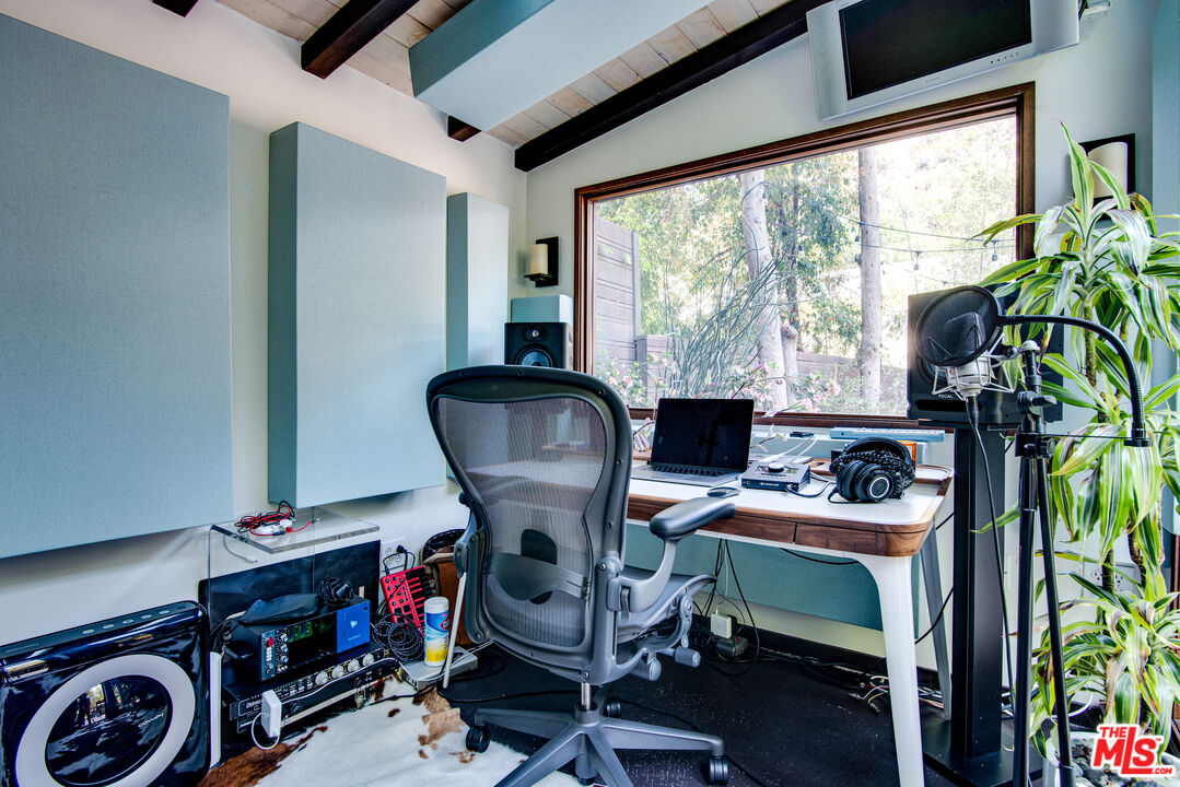 9624 Yoakum Drive Beverly Hills, CA 90210 - Photo 25 of 27 a workspace with furniture and a window