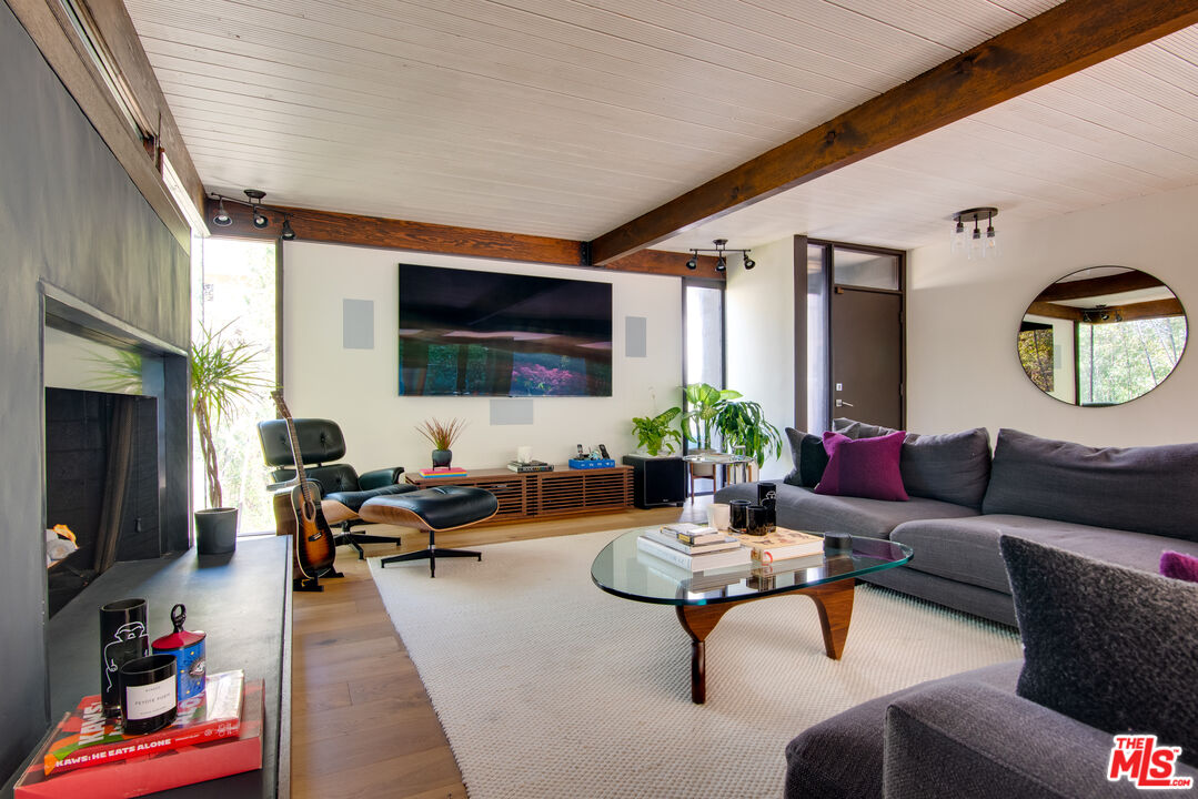 9624 Yoakum Drive Beverly Hills, CA 90210 - Photo 3 of 27 a living room with furniture and a flat screen tv