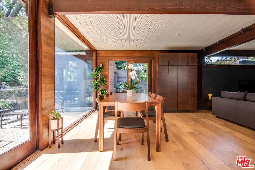9624 Yoakum Drive Beverly Hills, CA 90210 - Photo 6 of 27 a view of a dining room with furniture window and outside view