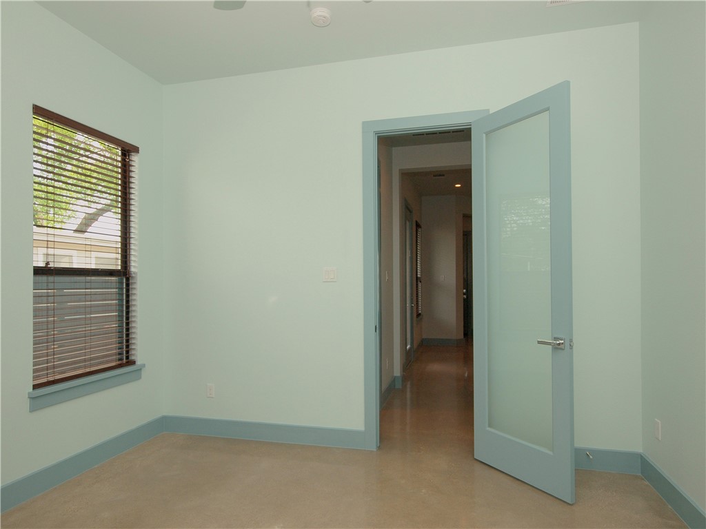 306 Franklin Boulevard, Unit A Austin, TX 78751 - Photo 11 of 19 a view of an empty room with closet and a window