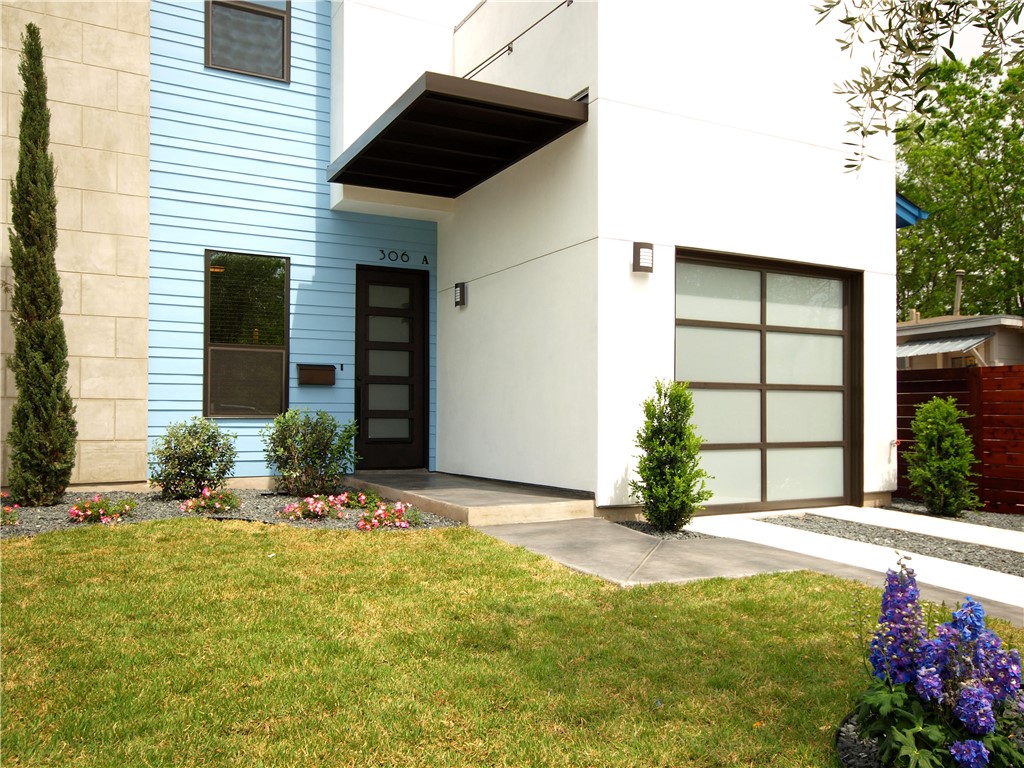 306 Franklin Boulevard, Unit A Austin, TX 78751 - Photo 3 of 19 a view of a house with a yard