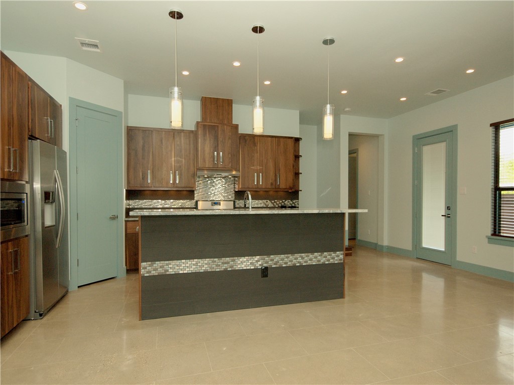 306 Franklin Boulevard, Unit A Austin, TX 78751 - Photo 6 of 19 a view of kitchen with kitchen island and stainless steel appliances