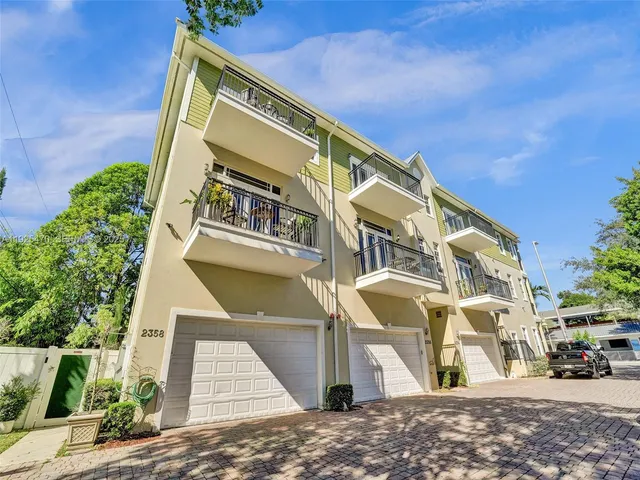 a view of a car park in front of a building