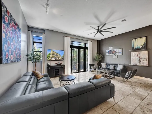 a kitchen with stainless steel appliances granite countertop a refrigerator stove and sink