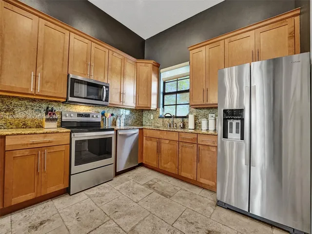 a spacious bedroom with a bed and a dresser