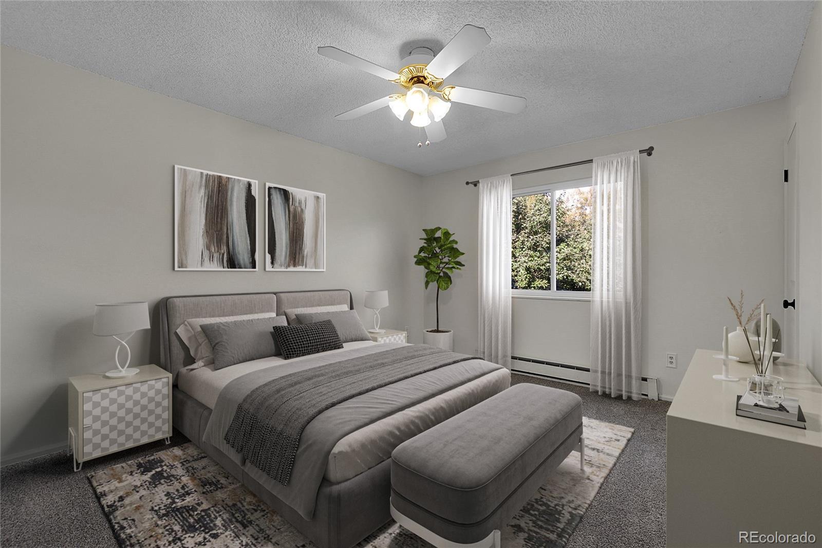 9324 Field Lane Broomfield, CO 80021 - Photo 12 of 43 a bedroom with a bed and a chandelier