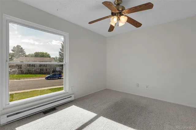 a bathroom with a sink mirror and toilet