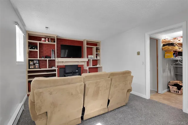 a bedroom with a bed and a night stand