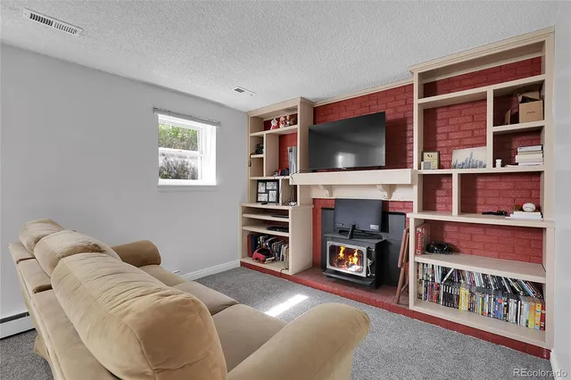 a view of yard with swimming pool and green space