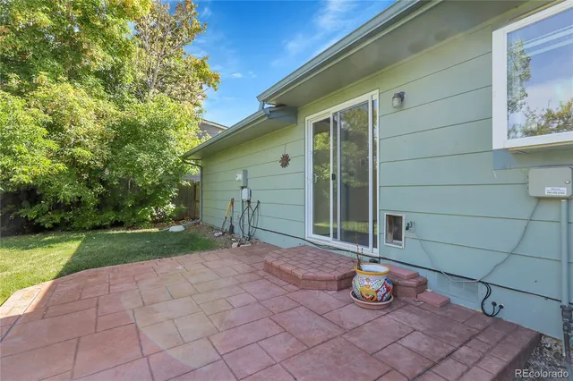 a picture of a bench in front of a wall