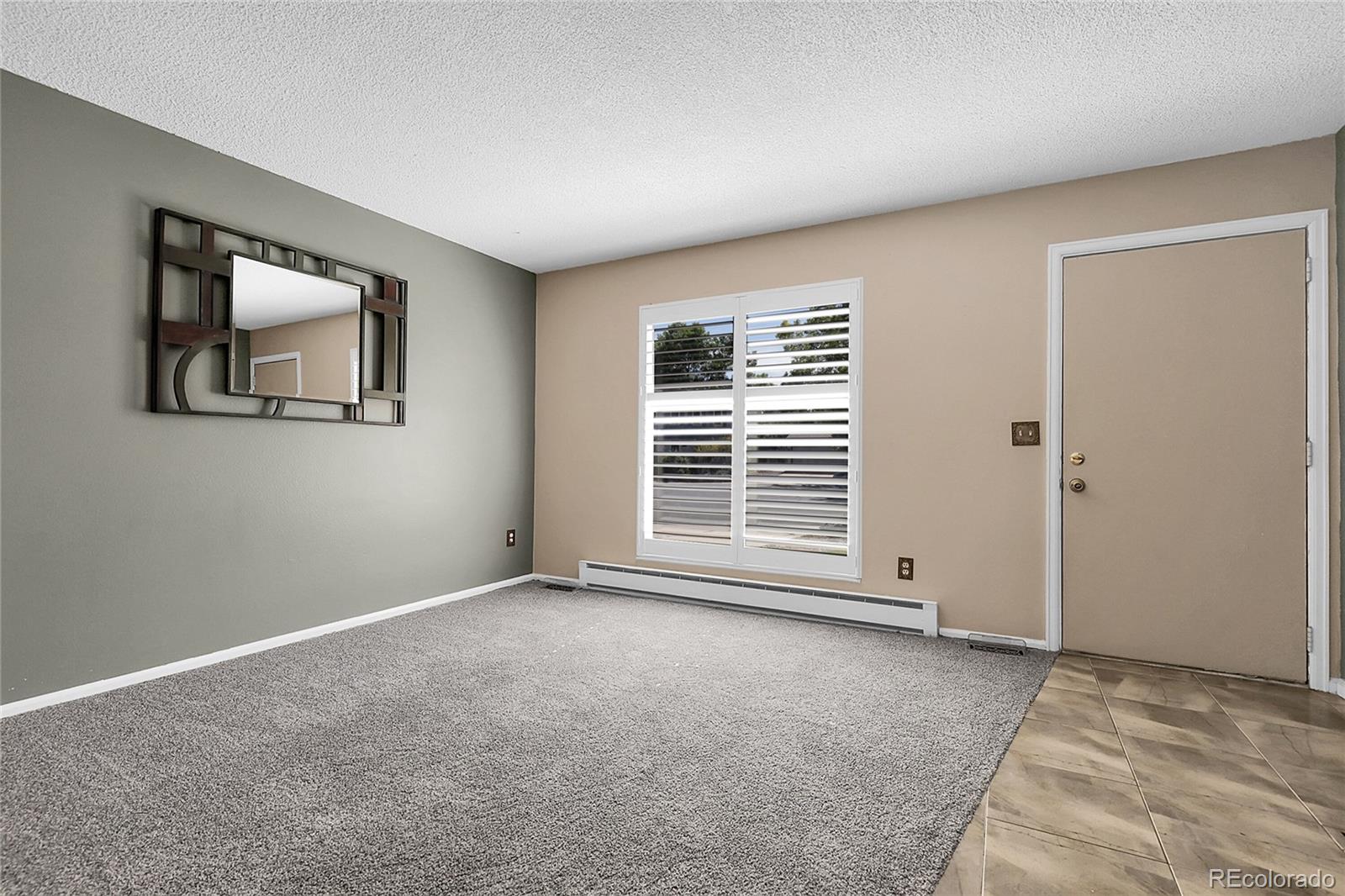 9324 Field Lane Broomfield, CO 80021 - Photo 5 of 43 a view of an empty room with a window