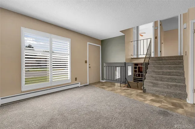 a kitchen with stainless steel appliances granite countertop a refrigerator stove and sink