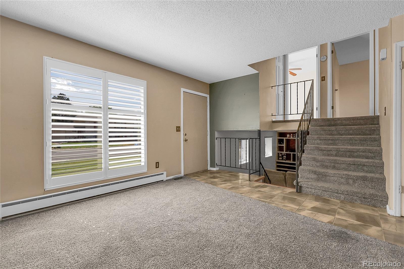9324 Field Lane Broomfield, CO 80021 - Photo 6 of 43 an empty room with windows