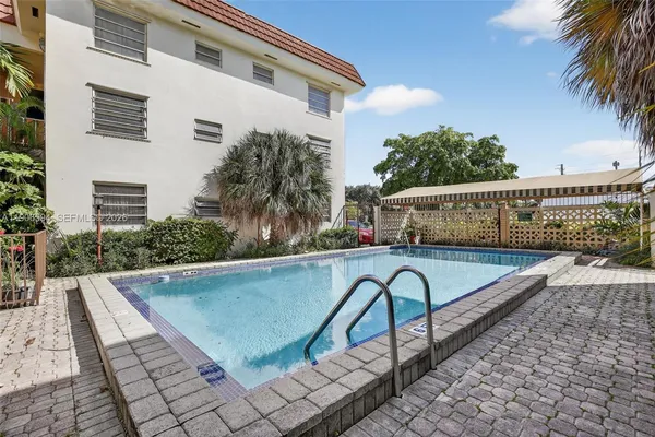 a view of a swimming pool with a patio