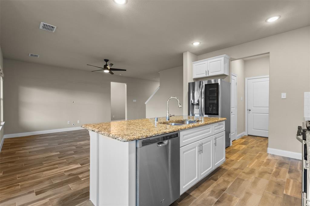 2900 Country Church Road McKinney, TX 75071 - Photo 10 of 40 a kitchen with a sink stove and refrigerator