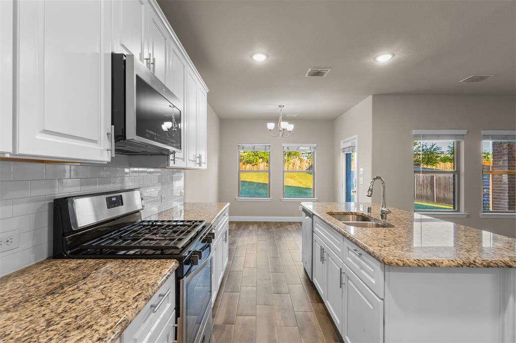 2900 Country Church Road McKinney, TX 75071 - Photo 12 of 40 a kitchen with sink stove and cabinets