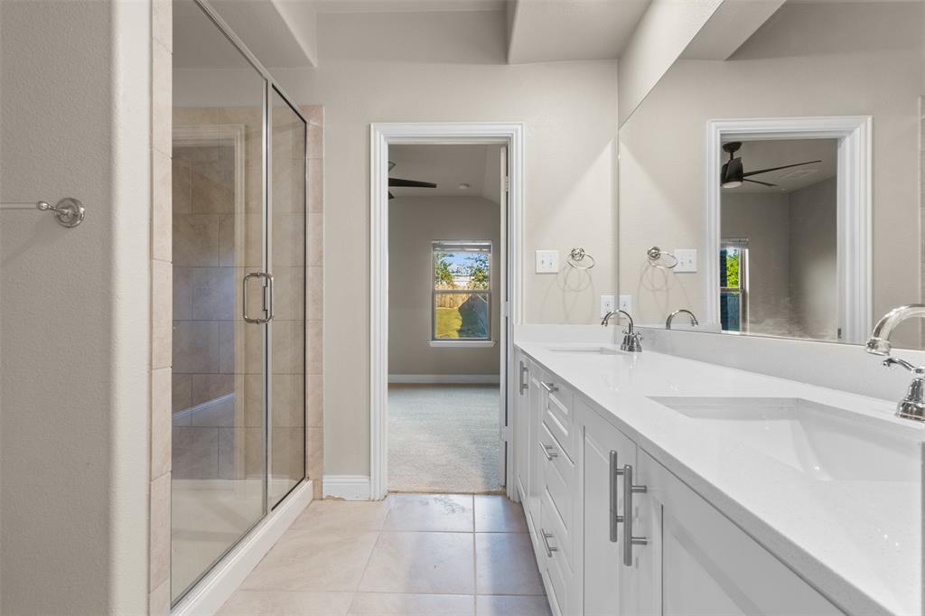 2900 Country Church Road McKinney, TX 75071 - Photo 18 of 40 a spacious bathroom with a double vanity sink mirror and shower