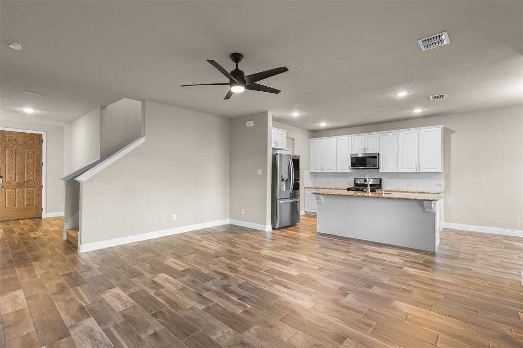 2900 Country Church Road McKinney, TX 75071 - Photo 39 of 40 a view of kitchen with refrigerator and microwave