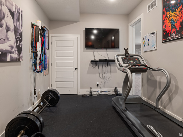 641 West 500 South Midway, UT 84049 - Photo 38 of 52 Dedicated fitness room with rubberized flooring, recessed lighting, and a wall-mounted television