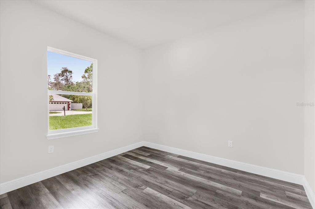 4535 Southwest 172nd Street Road Ocala, FL 34473 - Photo 15 of 35 an empty room with a window