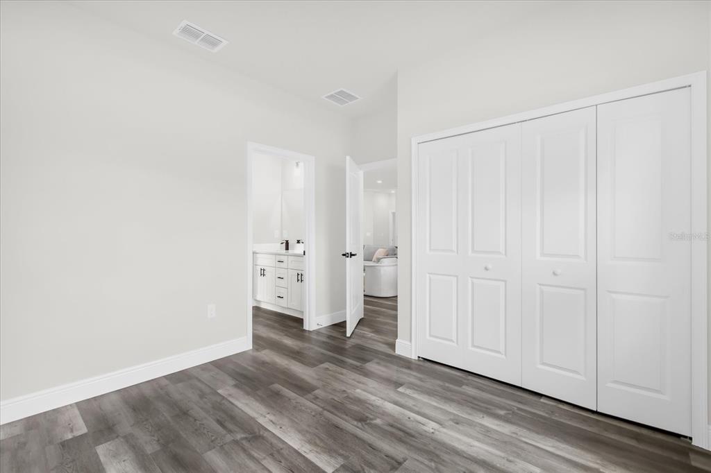 4535 Southwest 172nd Street Road Ocala, FL 34473 - Photo 16 of 35 a view of empty room with wooden floor