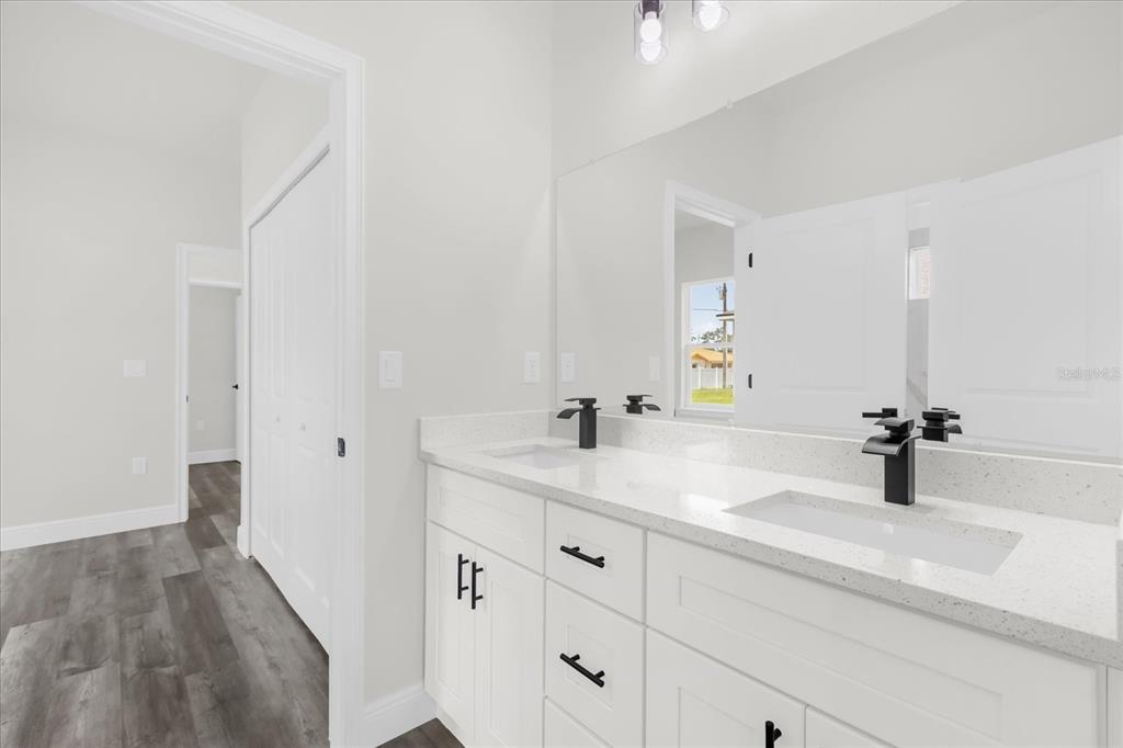 4535 Southwest 172nd Street Road Ocala, FL 34473 - Photo 17 of 35 a bathroom with a sink and a mirror