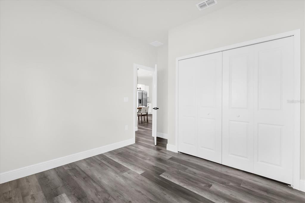4535 Southwest 172nd Street Road Ocala, FL 34473 - Photo 20 of 35 a view of empty room with wooden floor