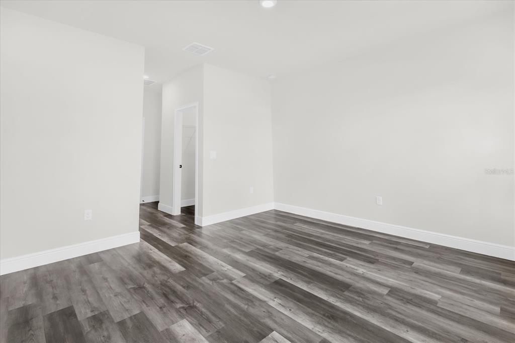 4535 Southwest 172nd Street Road Ocala, FL 34473 - Photo 25 of 35 a view of wooden floor and closet in a room