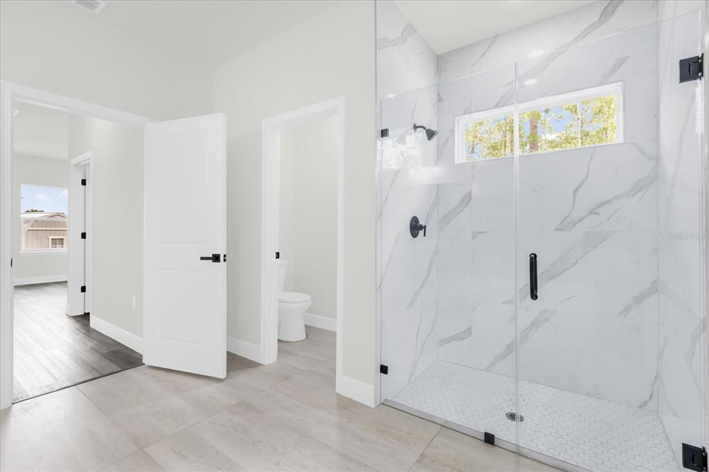 4535 Southwest 172nd Street Road Ocala, FL 34473 - Photo 28 of 35 a view of bathroom with shower