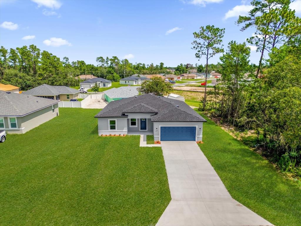 4535 Southwest 172nd Street Road Ocala, FL 34473 - Photo 31 of 35 a front view of a house with a yard
