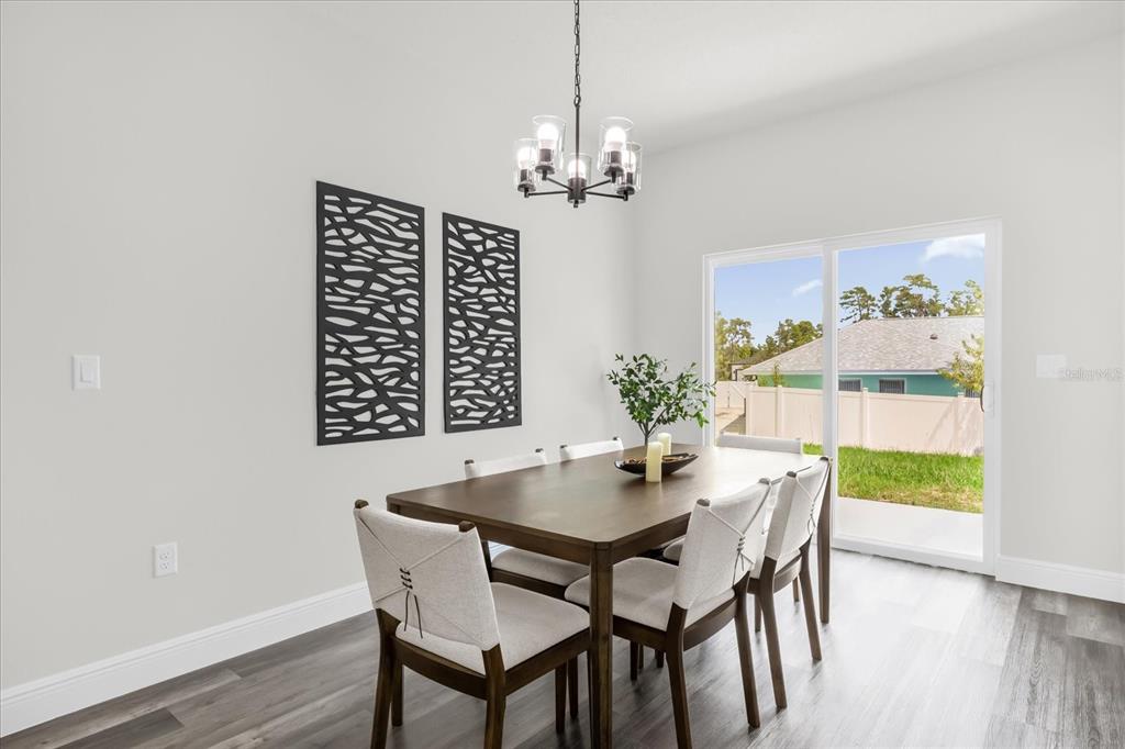 4535 Southwest 172nd Street Road Ocala, FL 34473 - Photo 10 of 35 a view of a dining room with furniture window and wooden floor