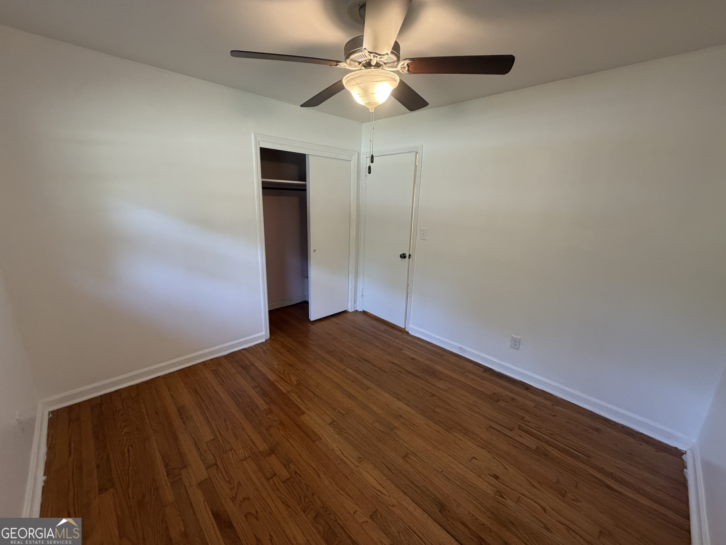 1005 North 1st Street Fort Valley, GA 31030 - Photo 15 of 28 a view of empty room with wooden floor