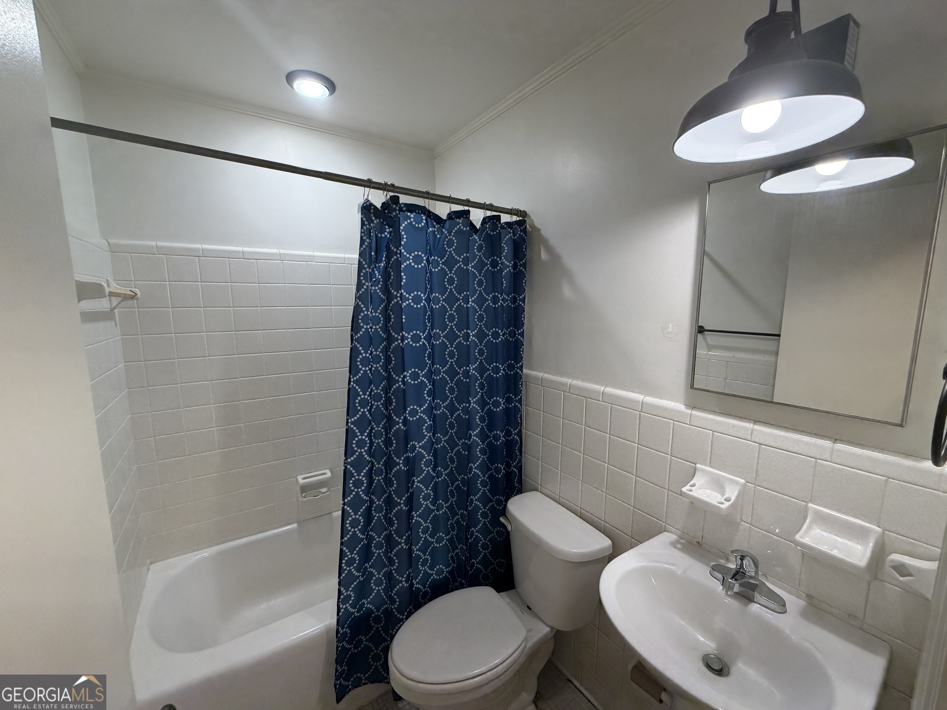 1005 North 1st Street Fort Valley, GA 31030 - Photo 23 of 28 a bathroom with a toilet sink and shower