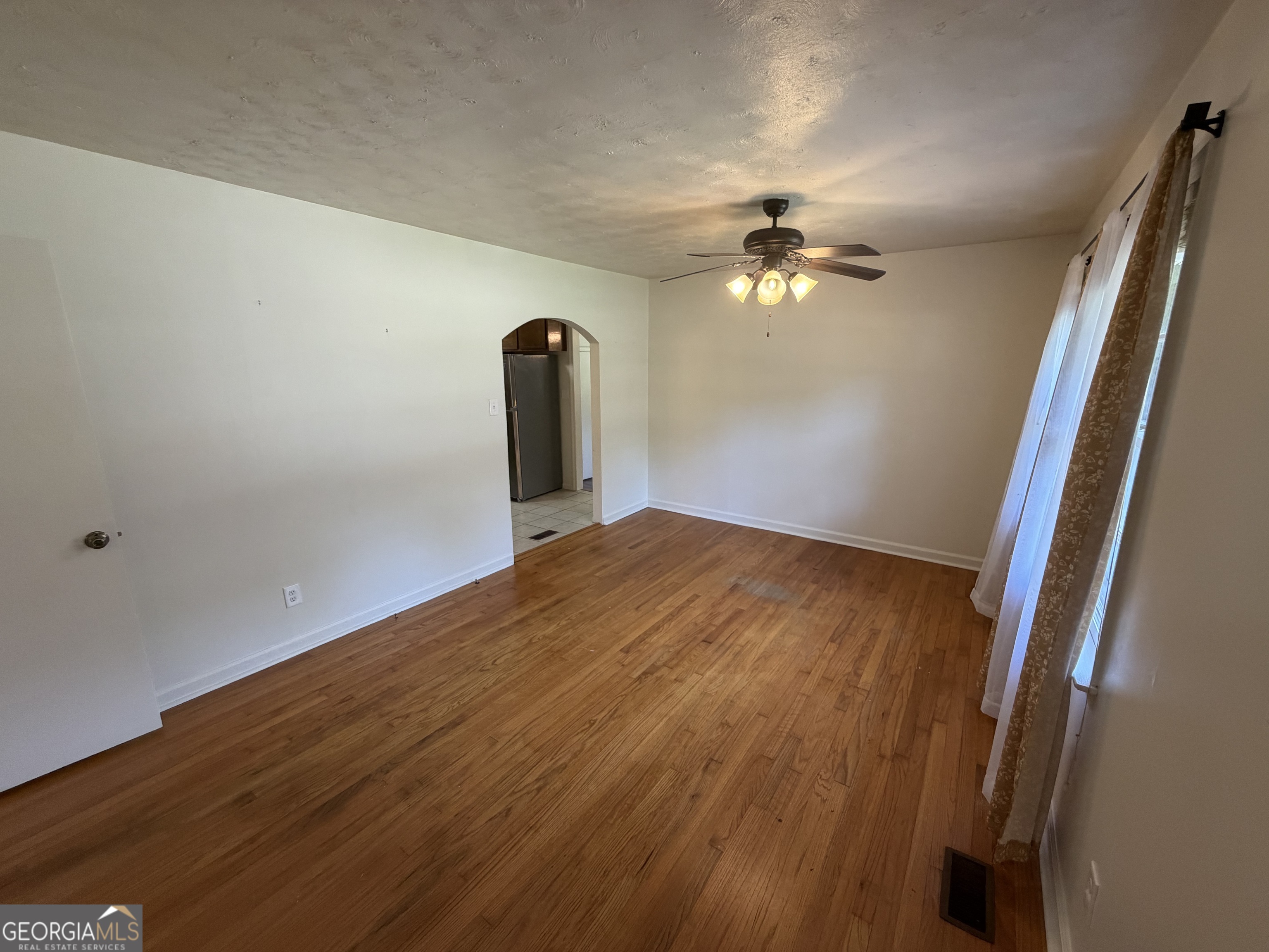 1005 North 1st Street Fort Valley, GA 31030 - Photo 4 of 28 wooden floor in an empty room